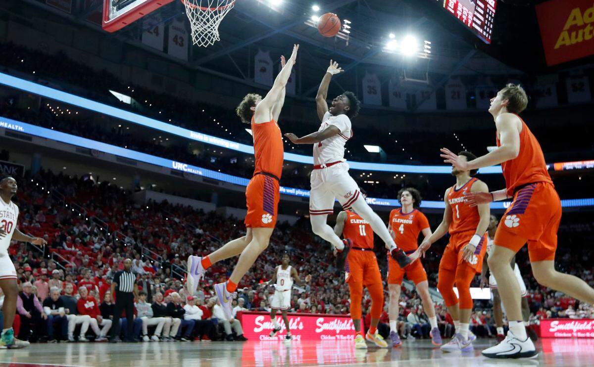 N.C. State’s Jarkel Joiner (1) shoots as Clemson’s Ben Middlebrooks (10) defends during Clemson’s 96-71 victory over N.C. State’s game at PNC Arena in Raleigh, N.C., Saturday, Feb. 25, 2023.