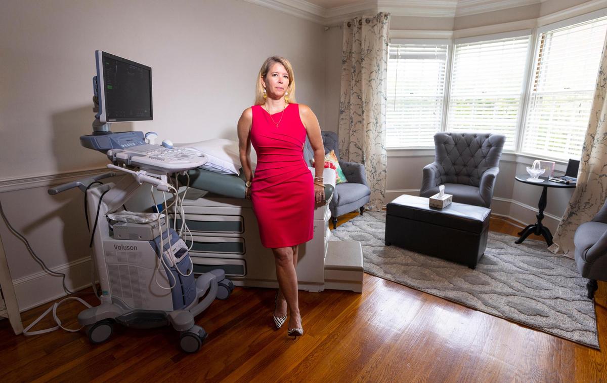 Tonya Baker Nelson poses in the ultrasound room at Hand of Hope Pregnancy Centers in Fuquay-Varina Tuesday, May 24, 2022.