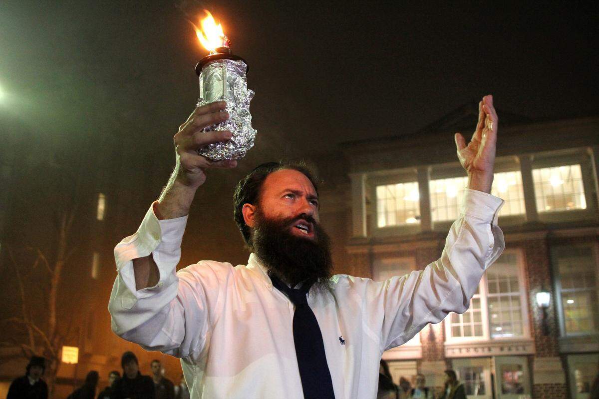 Rabbi Zalman Bluming, director of Chabad of Durham-Chapel Hill, in a 2015 Hanukkah celebration on the UNC campus in Chapel Hill. The holiday, he said, “is about brightening this world with acts of goodness and kindness, especially in these tumultuous and often dark times.”