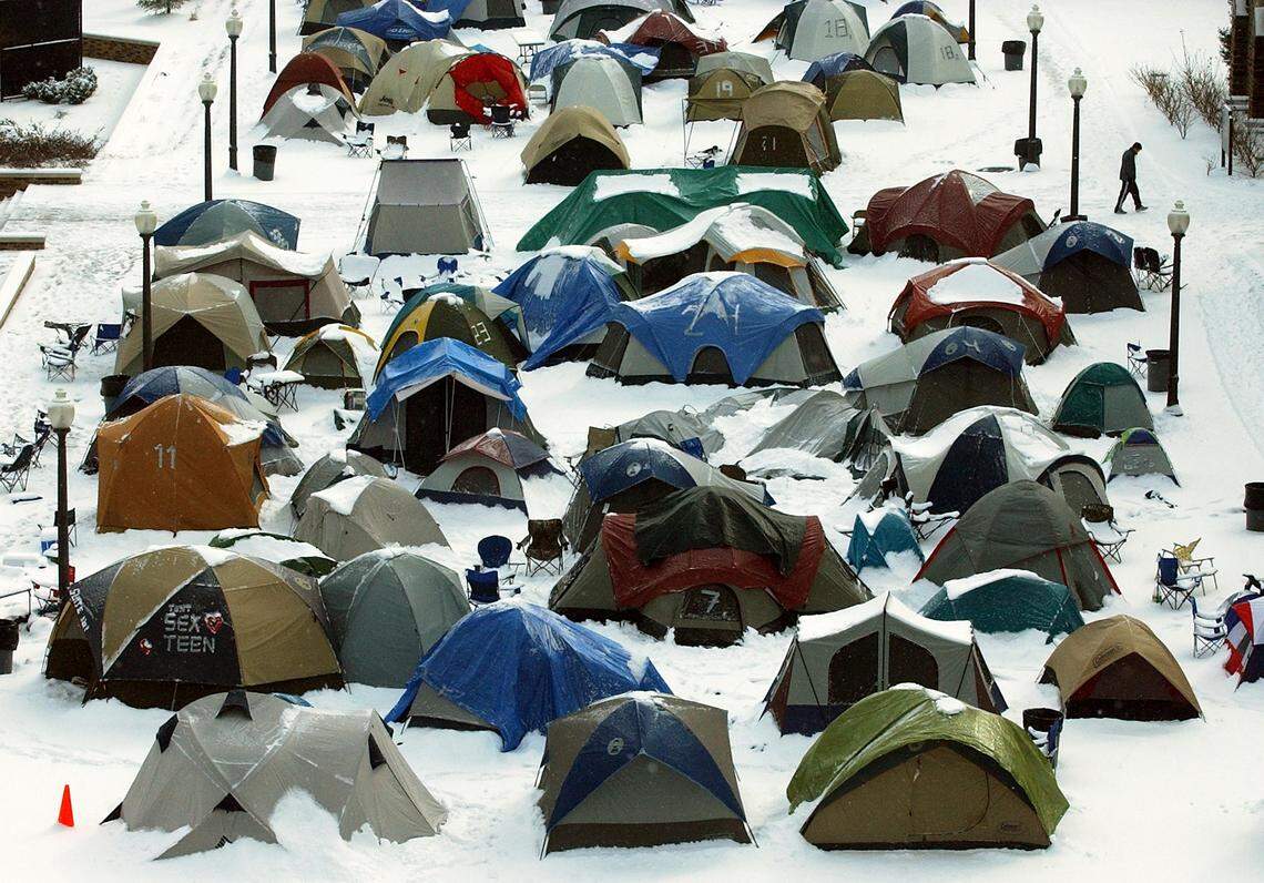 A Duke student walks past a deserted Krzyzewskiville after a winter storm with snow and brutally cold temperatures turned the tent city into a ghost town in 2003.