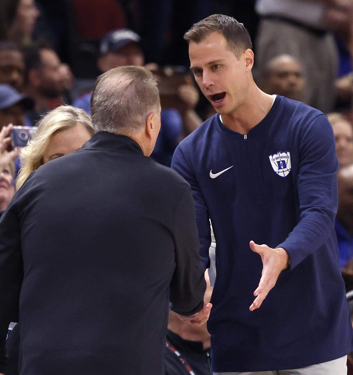 Duke head coach Jon Scheyer greets Michigan State head coach Tom Izzo before Duke’s game against Michigan State in the Champions Classic at the United Center in Chicago, IL, Tuesday, Nov. 14, 2023.