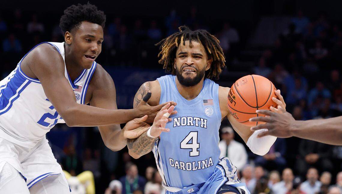 North Carolina’s RJ Davis (4) drives by Duke’s Patrick Ngongba II (21) during the first half of Duke’s game against UNC in the semifinals of the 2025 ACC Men’s Basketball Tournament at the Spectrum Center in Charlotte, N.C., Friday, March 14, 2025.