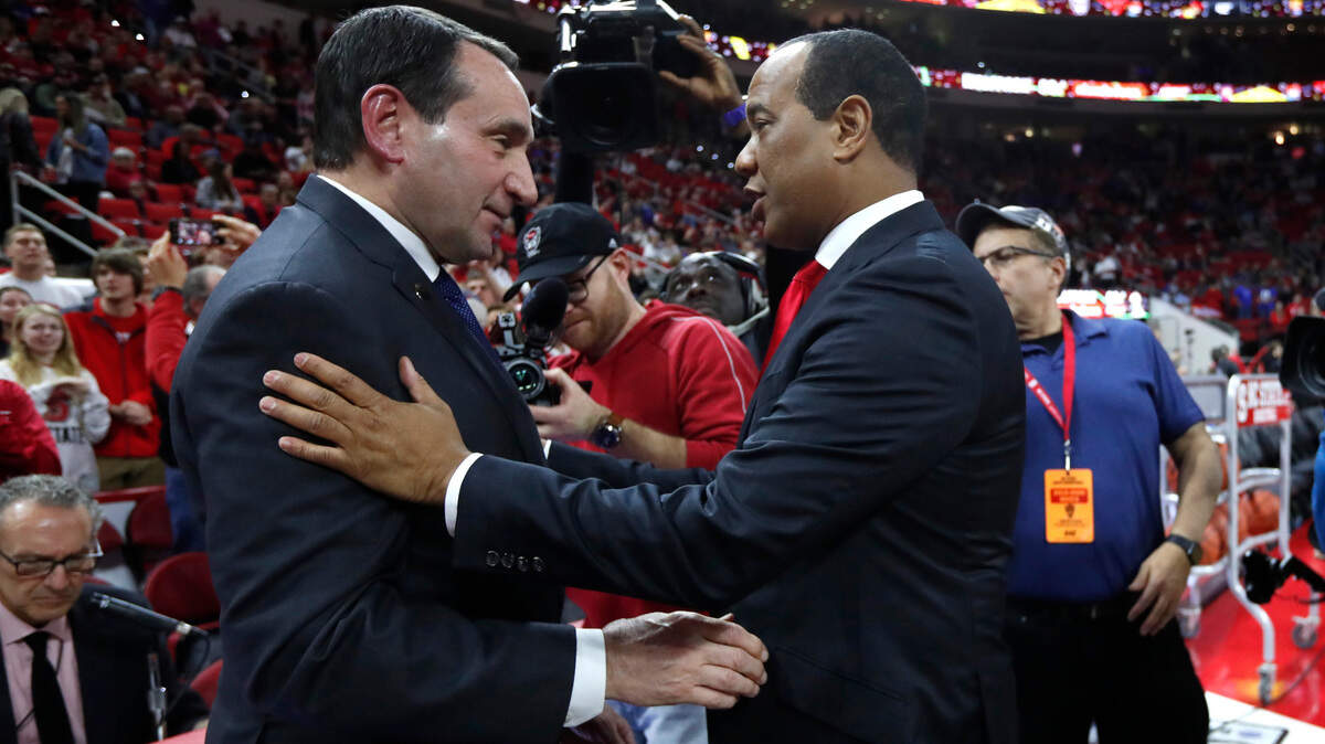Duke head coach Mike Krzyzewski talks with N.C. State head coach Kevin Keatts before Duke’s game with N.C. State at PNC Arena in Raleigh, N.C., Wednesday, Feb. 19, 2020.