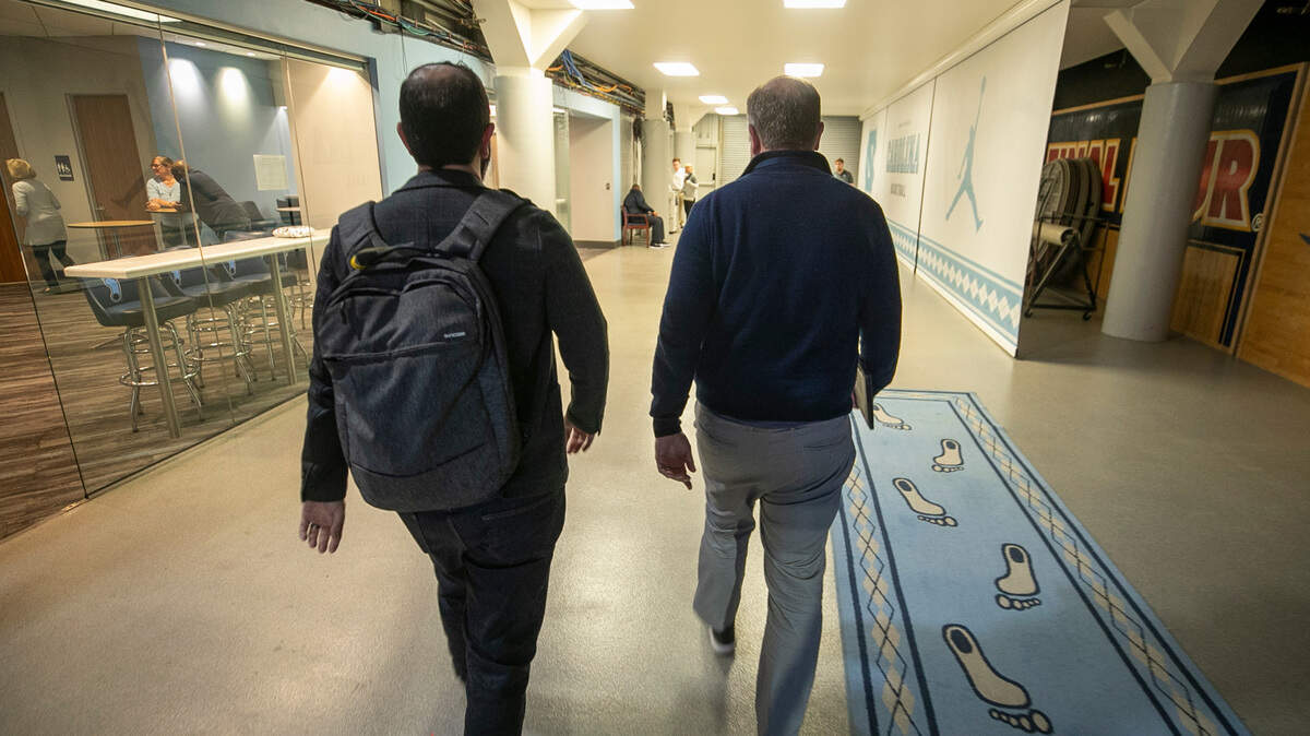 The News & Observer’s Luke DeCock and Joe Ovies of 99.9 The Fan, leave the Dean E. Smith Center at halftime of the North Carolina vs. Virginia game on Saturday, February 25, 2023 at the Smith Center in Chapel Hill, N.C.