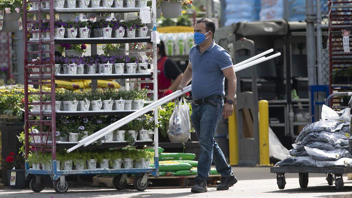 Jamal Zrhoudi owner of Willow Spring Heating & Air of Willow Spring, N.C. picks up some supplies at the Lowe’s Home Improvement store in Garner, N.C. on Monday afternoon, April 6, 2020.
