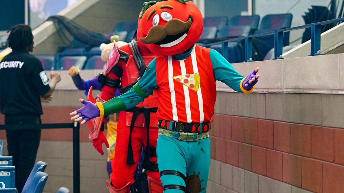 Fortnite’s Tomatohead dances through the arena during the Fortnite World Cup Finals e-sports event at Arthur Ashe Stadium in 2019.