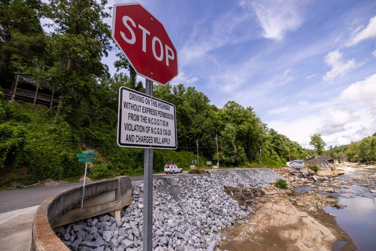 A view from the bridge where U.S. 64/74A intersect in Bat Cave on Friday, June 13, 2025, after Hurricane Helene devastated the area. A temporary road now connects Bat Cave and Chimney Rock after the storm destroyed a 2.5-mile stretch of U.S. 64/74A through Hickory Nut Gorge—one of the most severely damaged and costly road repairs in the state.