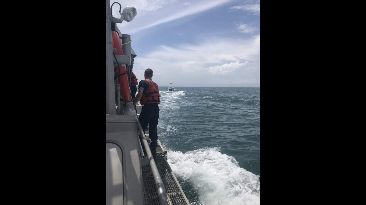 Coast Guard Petty Officer 2nd Class Josh Evans, a boat crewman at Station Oregon Inlet in Nags Head, North Carolina, works the deck as the station’s 47-foot Motor Life Boat crew escorts the 28-foot fishing vessel Clock Work ashore, May 22, 2018. The Clock Work’s crew called for help over VHF-FM channel 16 at 1 p.m. when their boat began taking on water 35 miles southeast of Oregon Inlet.