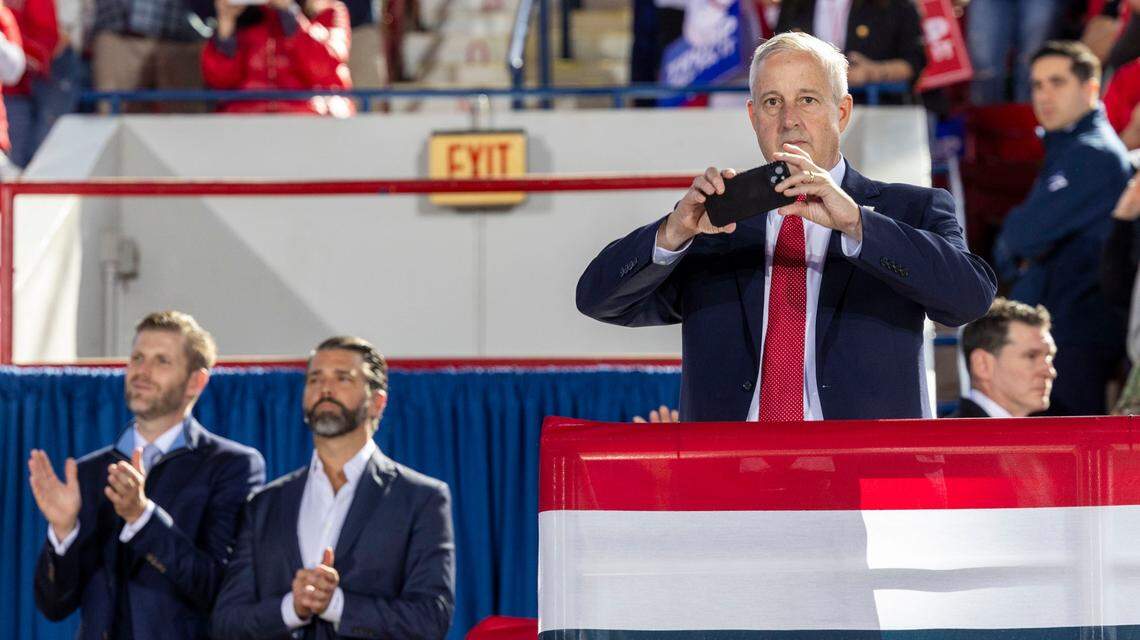 From left, brothers Eric and Don Jr. Trump and Michael Whatley, Chairperson of the Republican National Committee, watch as Republican presidential nominee and former President Donald Trump, speaks during a rally at Dorton Arena in Raleigh on Monday, Nov. 4, 2024, one day before Election Day.