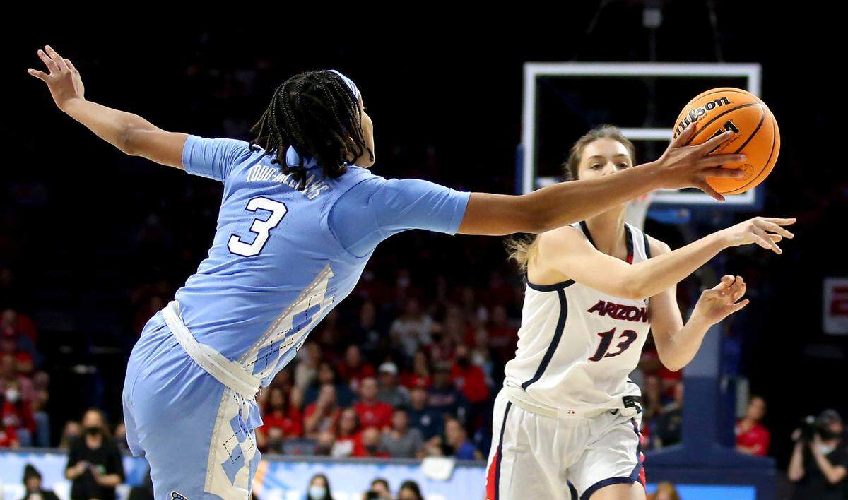 North Carolina guard Kennedy Todd-Williams (3) gets her hand on a pass from Arizona guard Helena Pueyo (13) during a women’s college basketball game in the NCAA tournament hosted in Tucson, Ariz., Monday, March 21, 2022. (Rebecca Sasnett/Arizona Daily Star via AP)