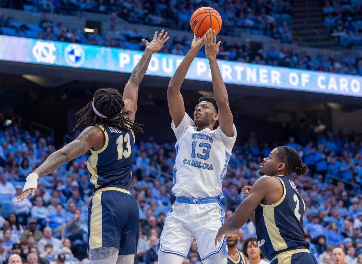 North Carolina’s Jalen Washington (13) puts up a shot over Charleston Southern’s Reginald Duhart Jr. (13) in the second half on Friday, December 29, 2023 at the Smith Center in Chapel Hill, N.C. Washington scored a career high 17 points in the Tar Heels’ victory.