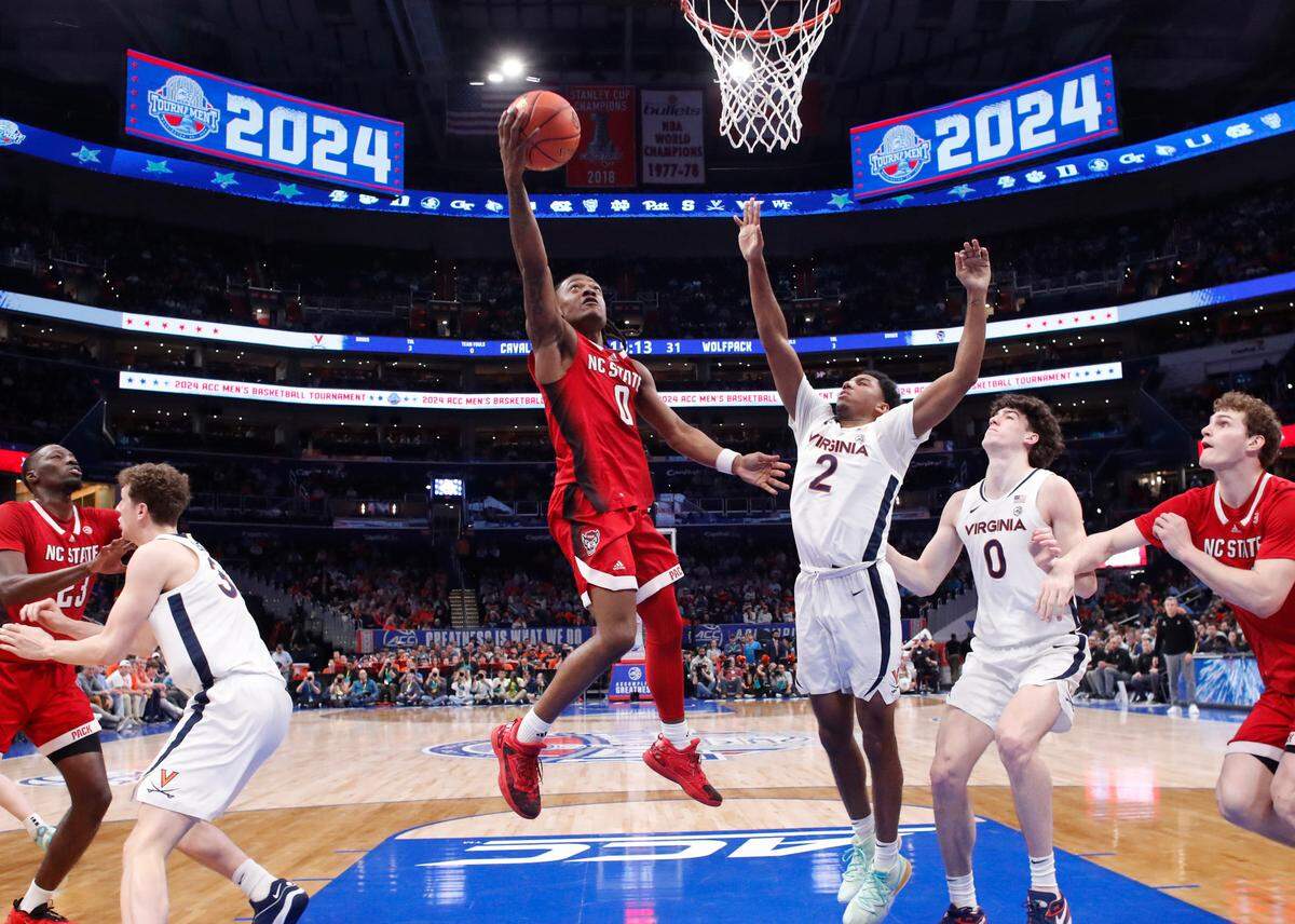 N.C. State’s DJ Horne (0) heads to the basket during N.C. State’s 72-65 overtime victory over Virginia in the semifinals of the 2024 ACC Men’s Basketball Tournament at Capital One Arena in Washington, D.C., Friday, March 15, 2024.
