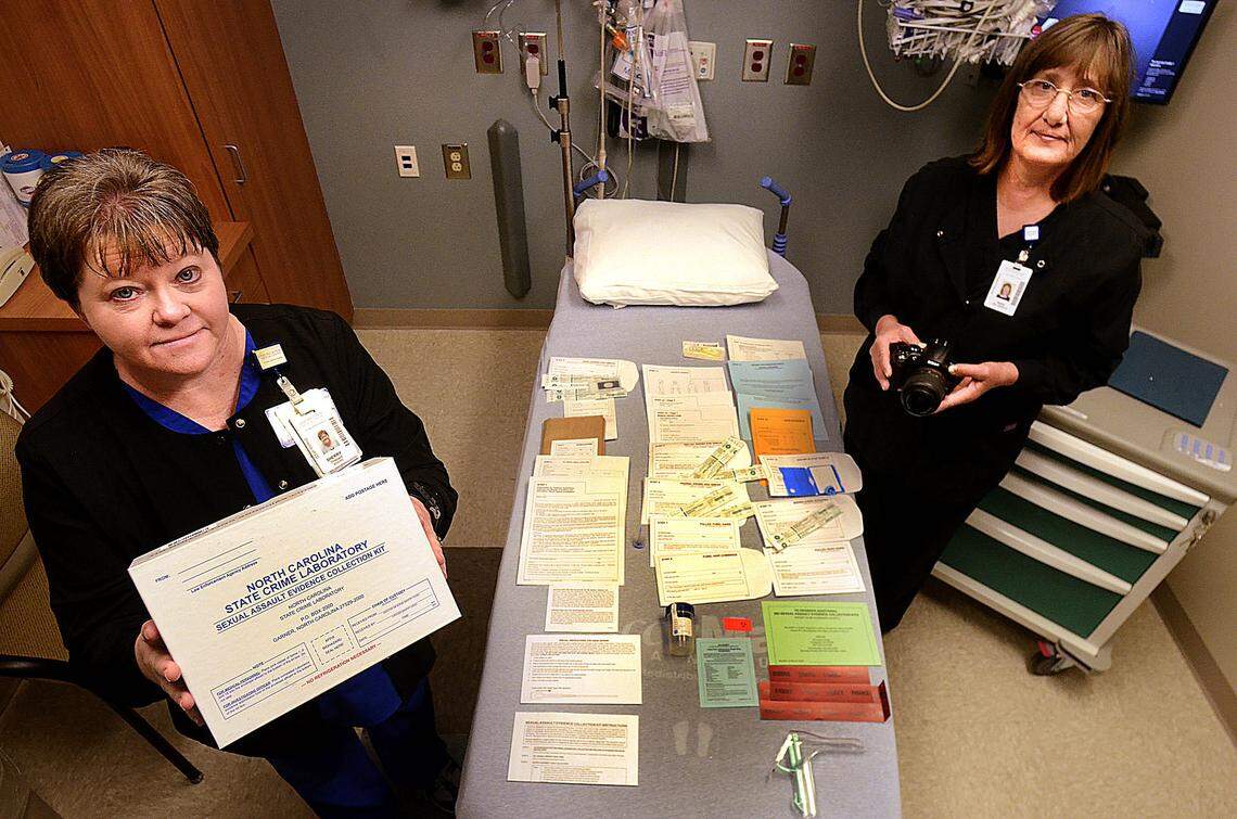 ROBERT C. REED/HICKORY DAILY RECORD: Sherry Shepard and Karen Palm are sexual assault nurse examiners at Frye Regional Medical Center. Here Shepard and Palm display all of the components to a N.C. State Crime Lab sexual assault evidence collection kit.