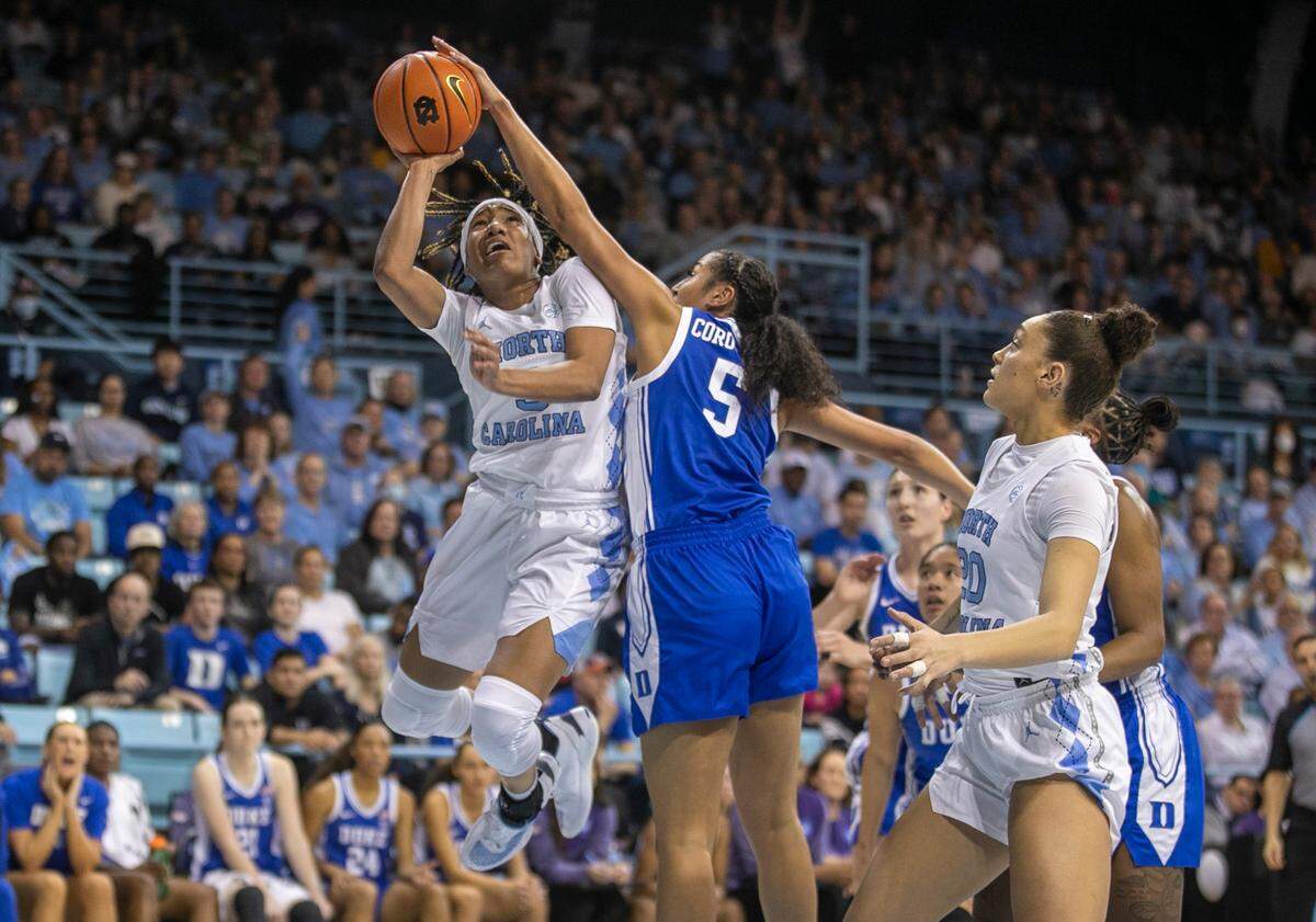 North Carolina’s Kennedy Todd-Williams (3) drives to the basket against Duke’s Taya Corosdale (5) during the second quarter on Thursday, January 19, 2023 at Carmichael Arena in Chapel Hill, N.C.