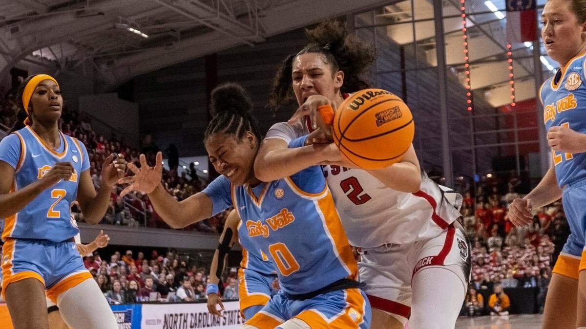NC State’s Mimi Collins (2) gets tangled up with Tennessee’s Jewel Spear (0) during the first half of the second round of the Division I Women’s Basketball Championship at Reynolds Coliseum in Raleigh, North Carolina, on March 25, 2024.