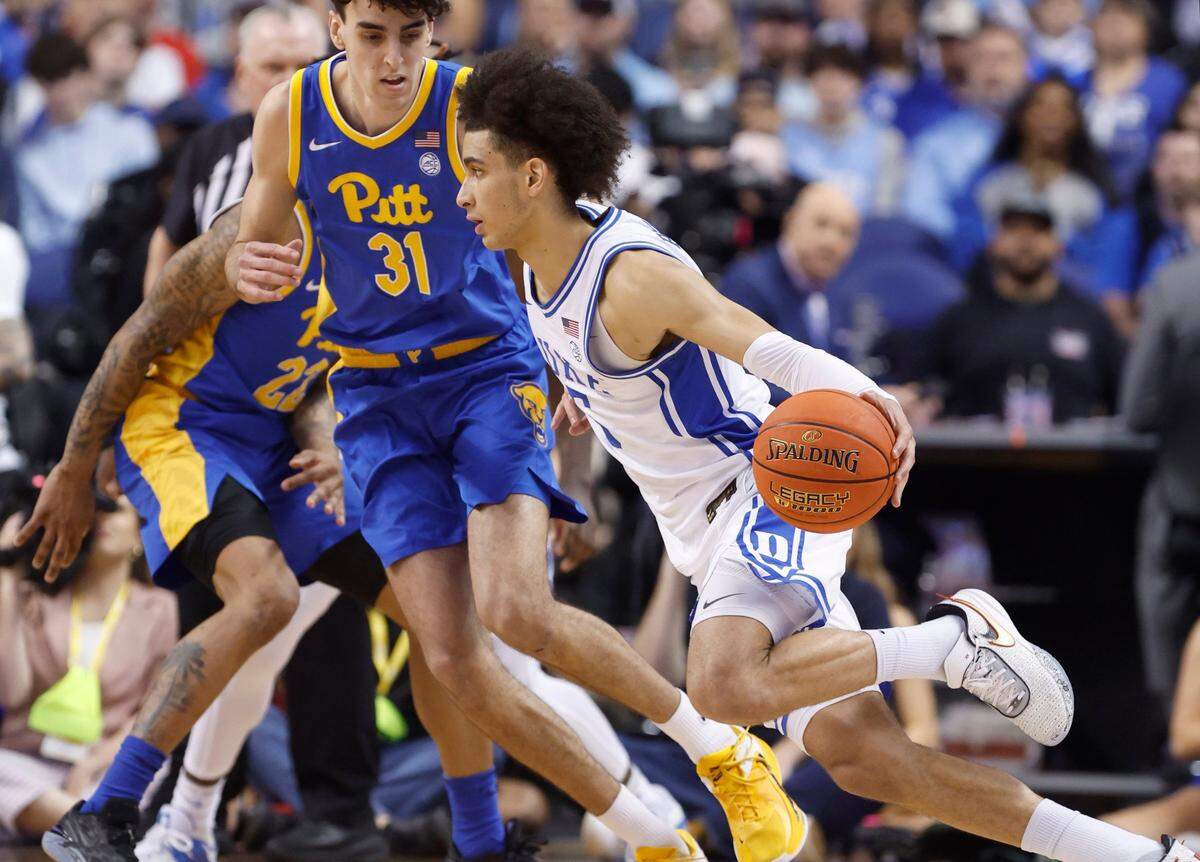 Duke’s Tyrese Proctor (5) drives around Pittsburgh’s Jorge Diaz Graham (31) during the first half of Duke’s game against Pitt in the quarterfinals of the ACC Men’s Basketball Tournament in Greensboro, N.C., Thursday, March 9, 2023.
