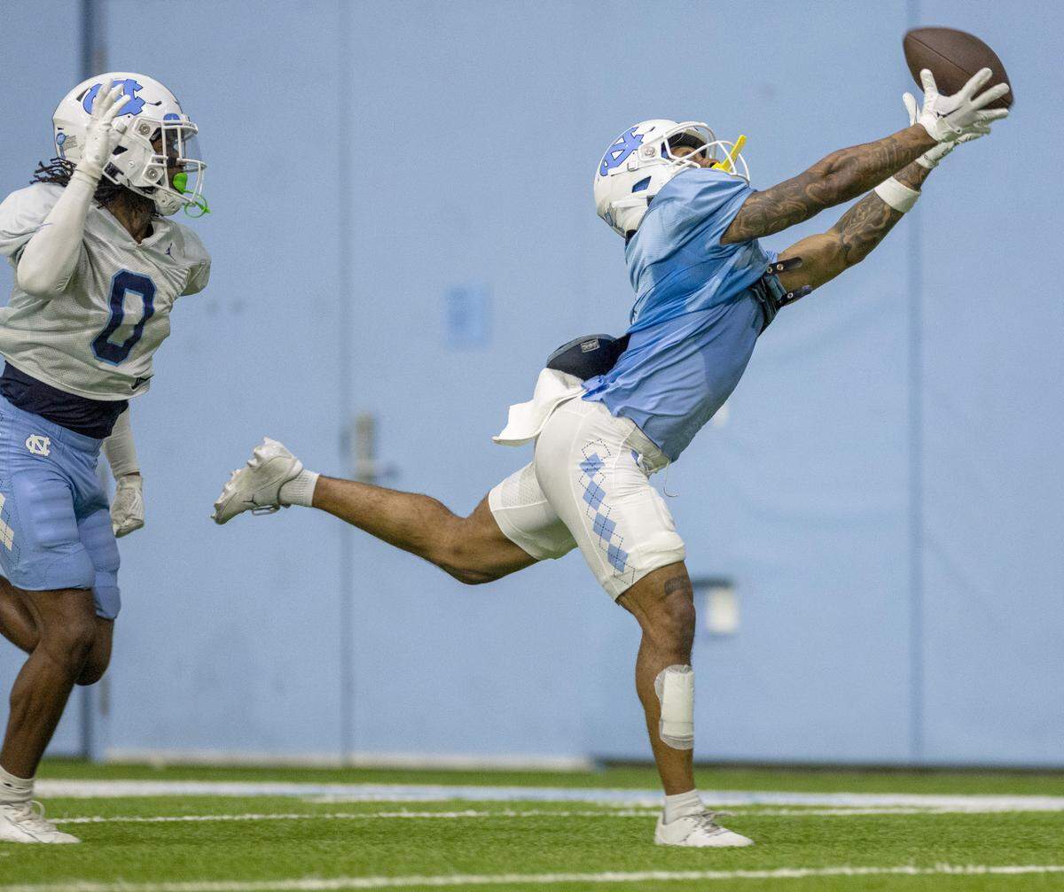 North Carolina wide receiver Nate McCollum (6) pulls in a pass from quarterback Max Johnson during the Tar Heels’ scrimmage on Thursday, April 11, 2024 in Chapel Hill, N.C.
