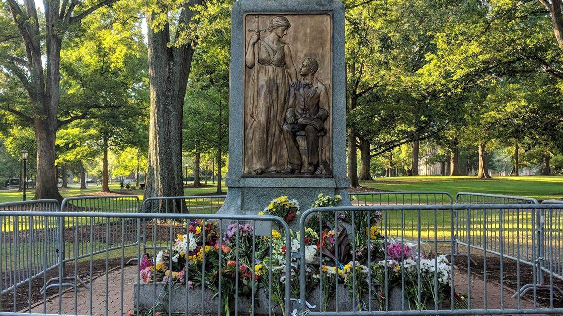 The North Carolina Division of the Sons of Confederate Veterans placed flowers at the base that once held the “Silent Sam” statue on UNC’s Chapel Hill campus.