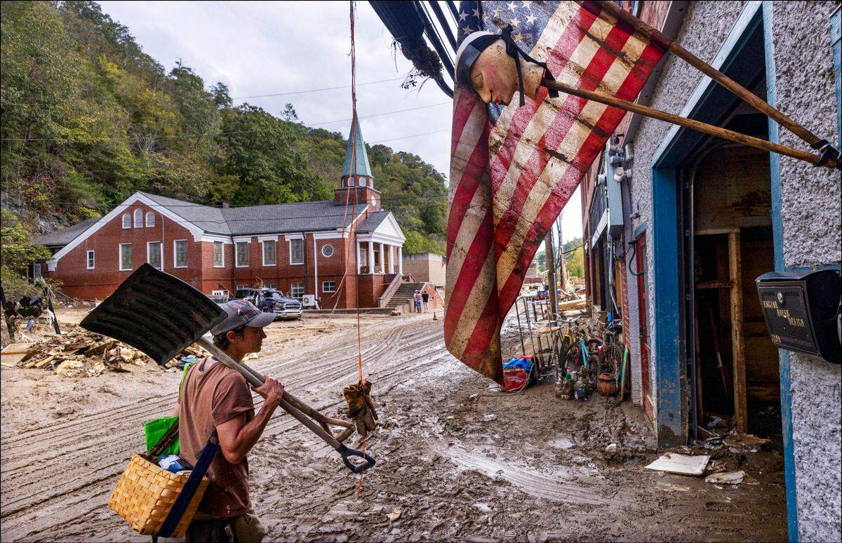 Jen Dombrowski arrives in downtown Marshall to help a friend clean up her business on Tuesday, Oct. 1, 2024 after the French Broad River caused catastrophic flooding. The remnants of Hurricane Helene caused widespread flooding, downed trees, and power outages in western North Carolina.