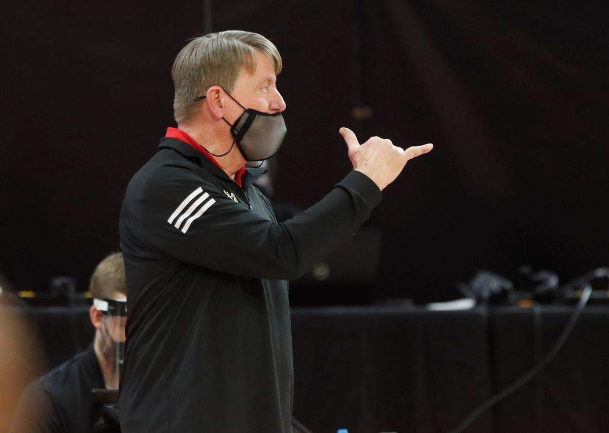 N.C. State head coach Wes Moore gives his team instructions during the second half of N.C. State’s 83-53 victory over Pittsburgh at Reynolds Coliseum in Raleigh, N.C., Thursday, February 25, 2021.