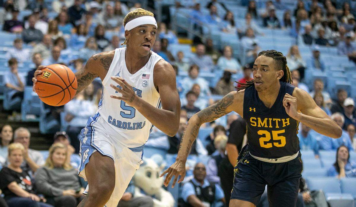 North Carolina’s Armando Bacot (5) drives to the basket against Johnson C. Smith’s Jataveous Watson (25) in the first half during an exhibition game on Friday, October 28, 2022 at the Smith Center in Chapel Hill, N.C. Bacot scored 12 points and had 20 rebounds.