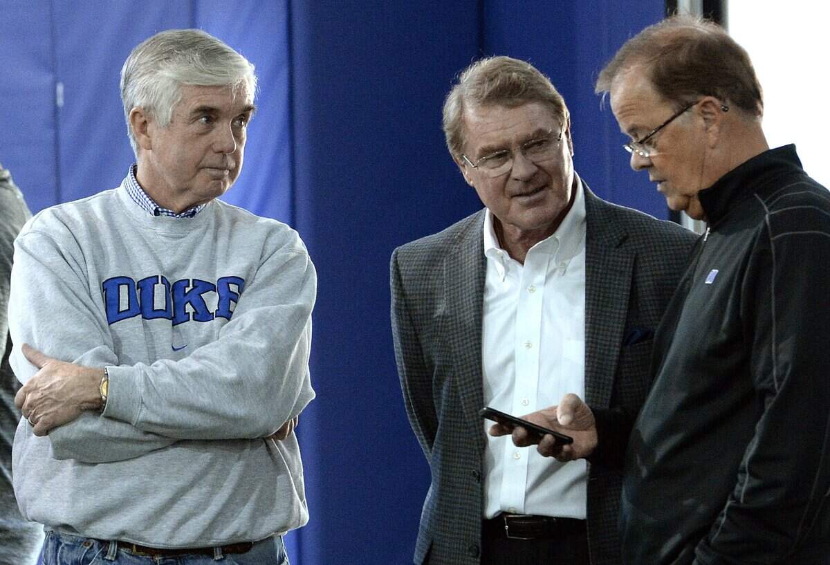 Duke athletic director Kevin White, left, and football coach David Cutcliffe speak with ACC Commissioner John Swofford during Duke football Pro Day in Durham, N.C., in 2017.