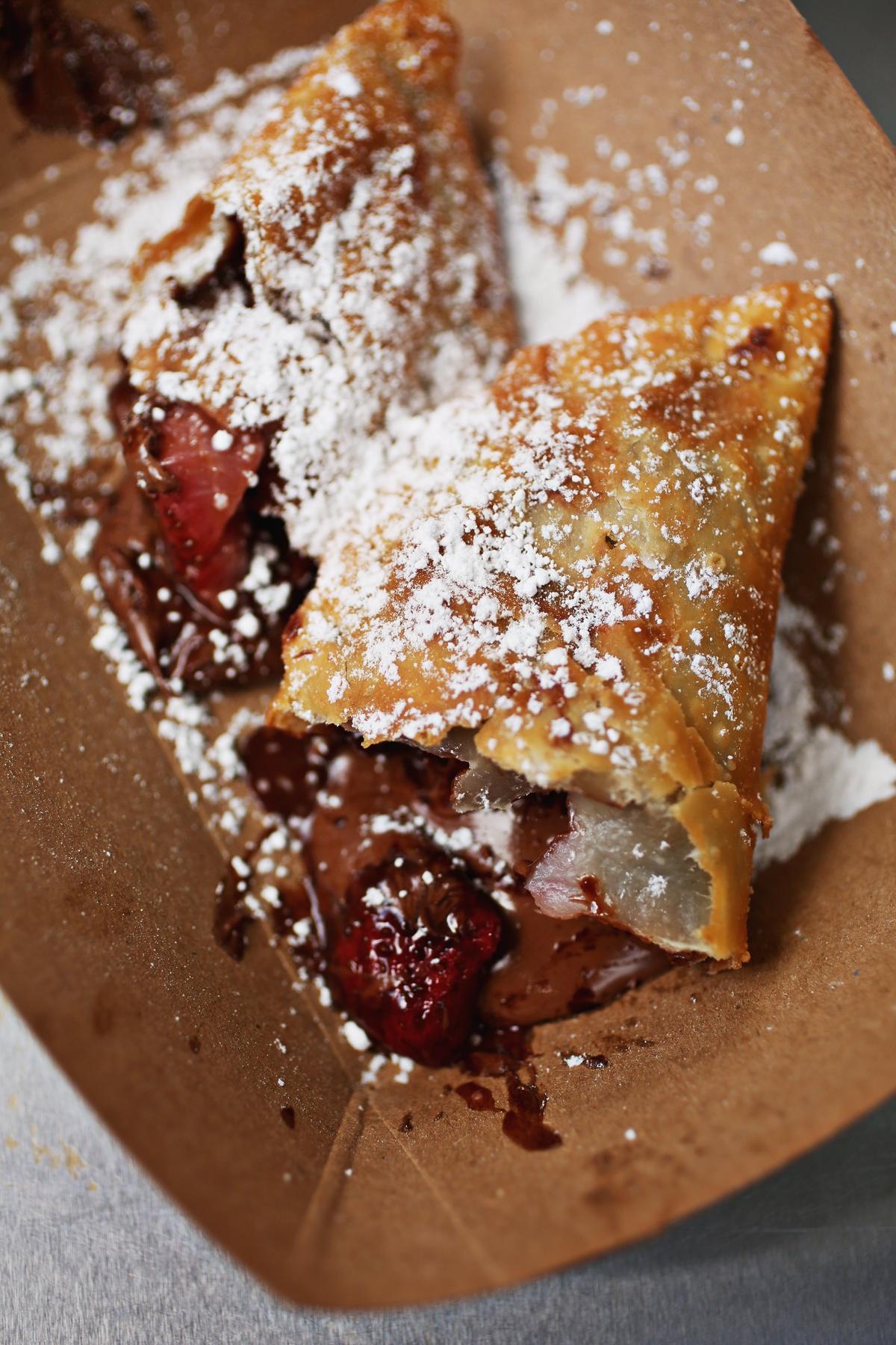 Add a dessert empanada , such as the Nutella-strawberry, to your order from Fuzzy’s Empanadas food truck.