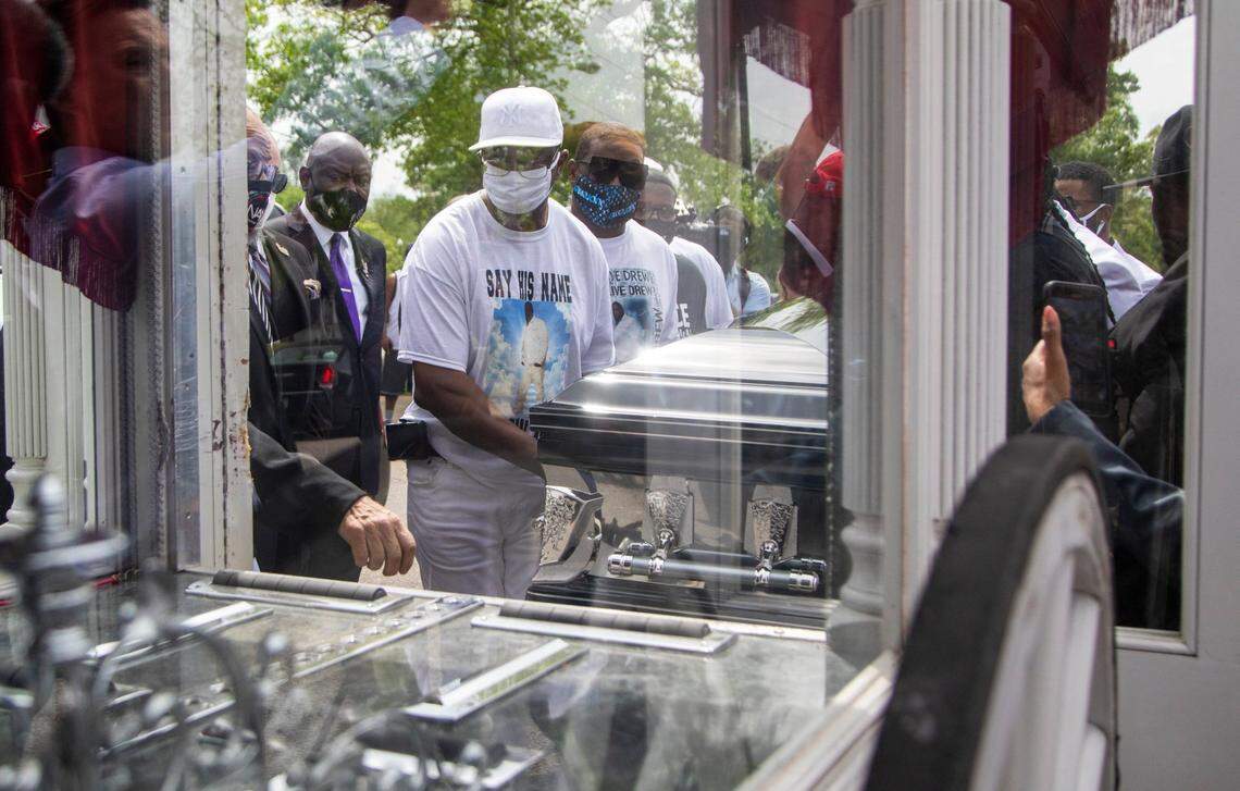 The casket of Andrew Brown Jr. is loaded into a horse-drawn carriage and taken to the Fountain of Life Church in Elizabeth City, NC for a funeral service Monday, May 3, 2021. Brown was shot and killed by Pasqoutank County Sheriff deputies in April.