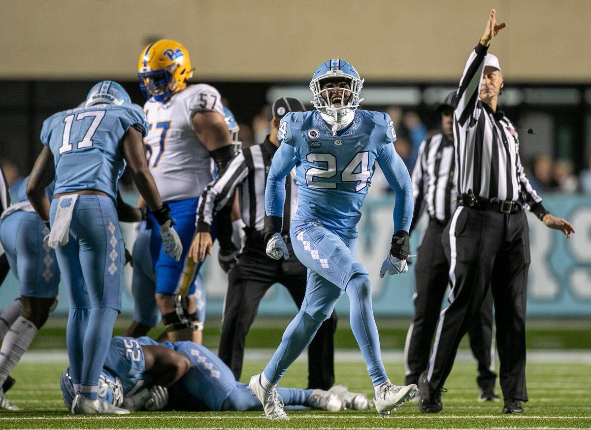 North Carolina’s Malaki Hamrick (24) reacts after teammate Cedric Grey forced a fumble by Pitt’s Israel Abanikanda and recovered the ball in the fourth quarter on Saturday, October 29, 2022 at Kenan Stadium in Chapel Hill, N.C.