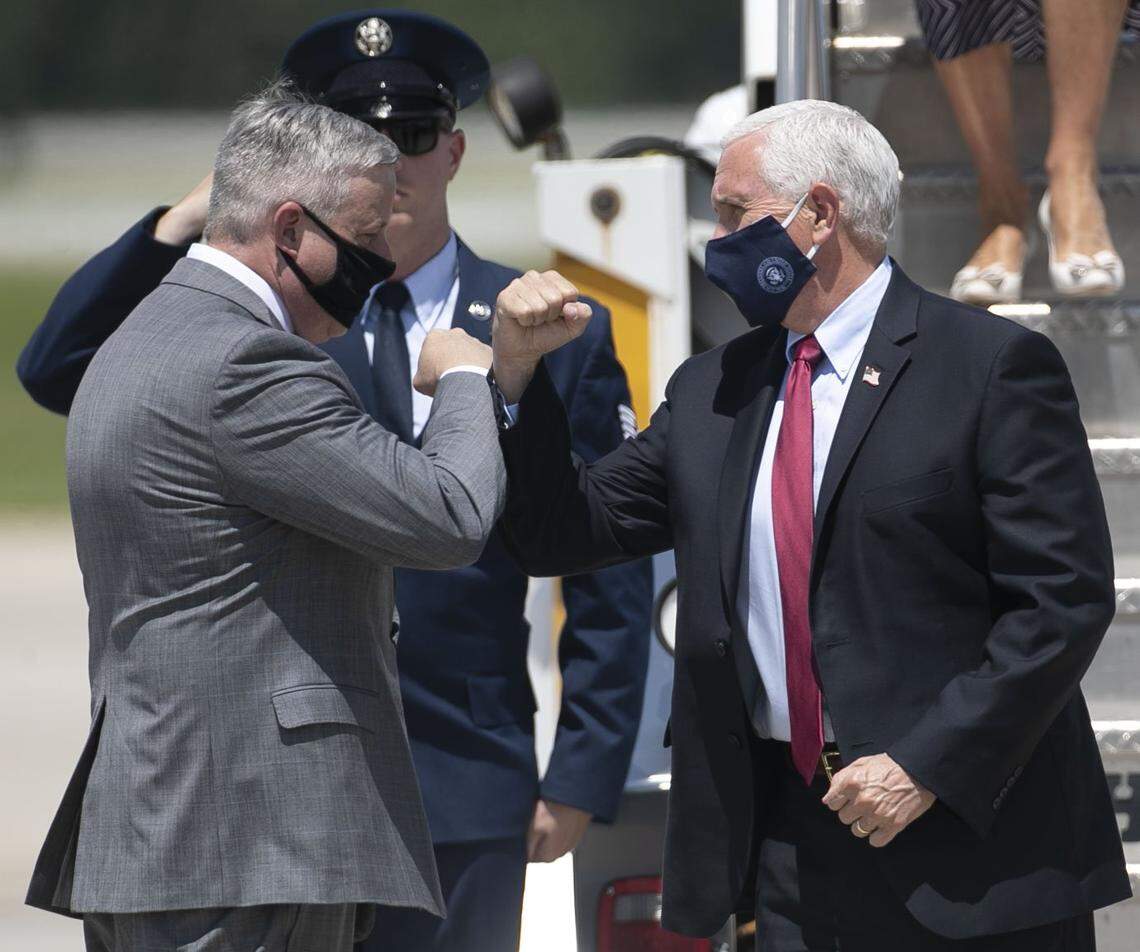 NC GOP chairman Michael Whatley, greets Vice President Pence, and travel companions at Raleigh-Durham International Airport on Wednesday, July 29, 2020 in Morrisville, N.C.