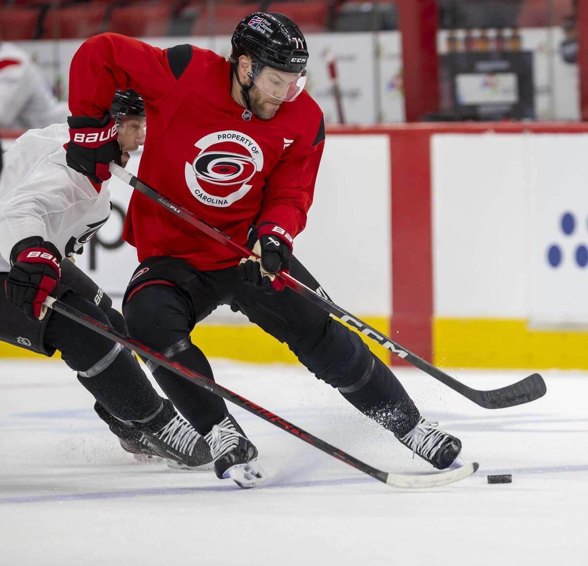 Carolina Hurricanes left wing Taylor Hall (71) pushes the puck ahead of teammate center Jordan Staal (11) during practice on Tuesday, May 12, 2026, at Lenovo Center in Raleigh, N.C.