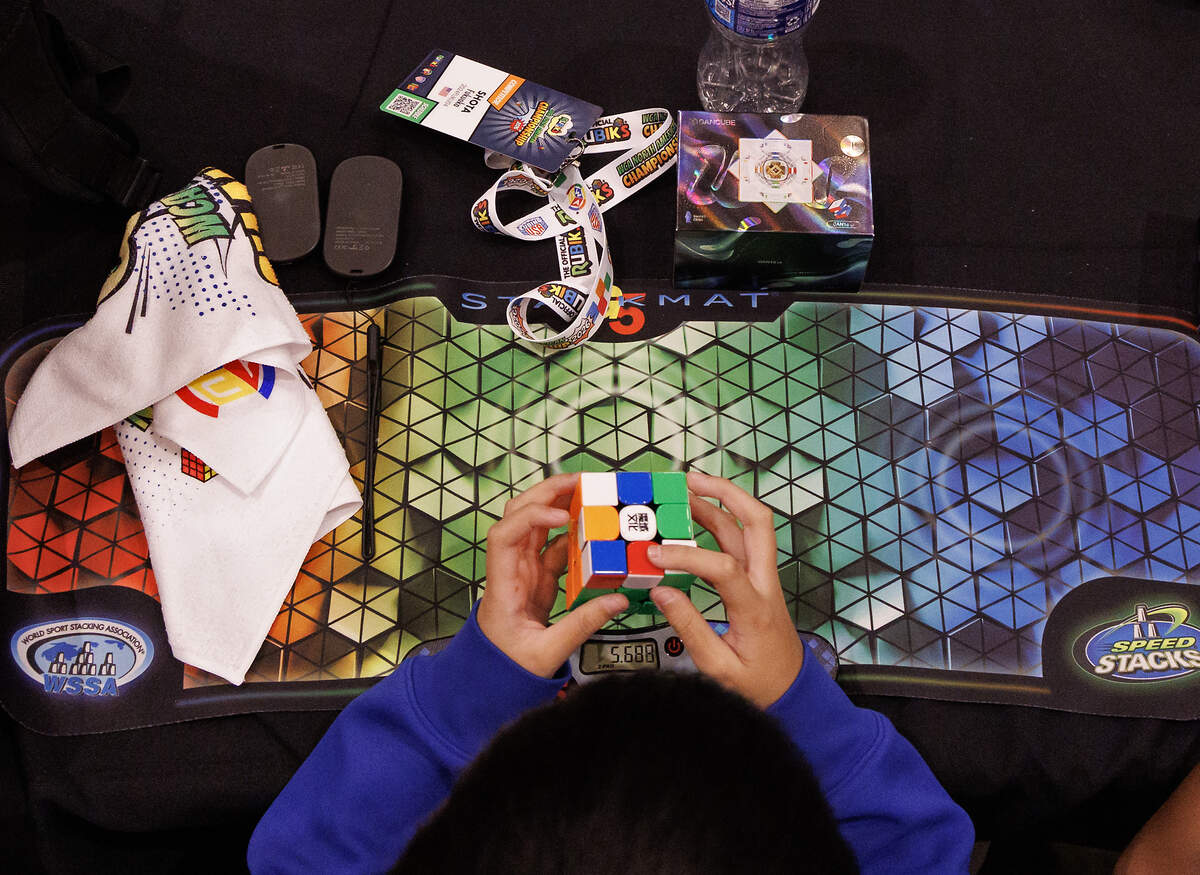 Shota Fukuoka practices solving a cube puzzle during the Rubik’s WCA North American Championship at the Raleigh Convention Center on Thursday, July 2, 2026.