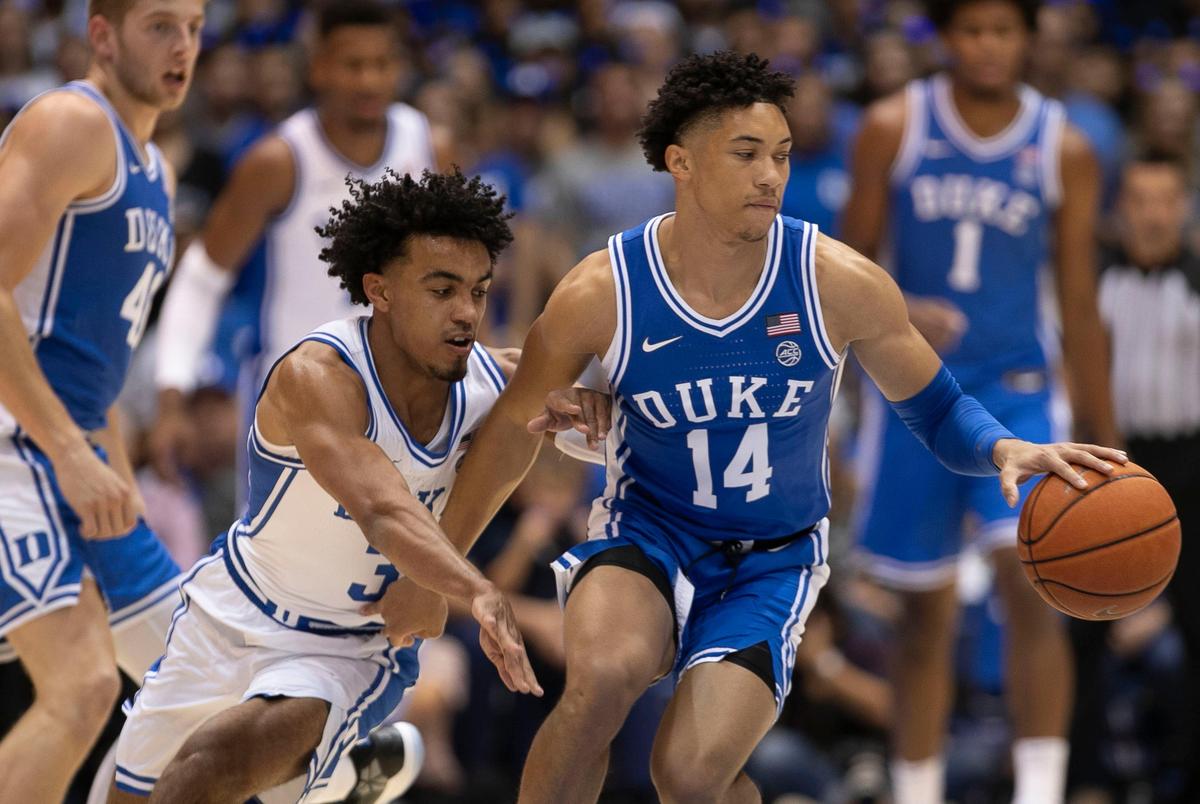Duke’s Tre Jones (3) tries for a steal from Jordan Goldwire (14) during the Blue Devils’ scrimmage at the annual Countdown to Craziness on Friday, October 18, 2019 at Cameron Indoor Stadium in Durham, N.C.