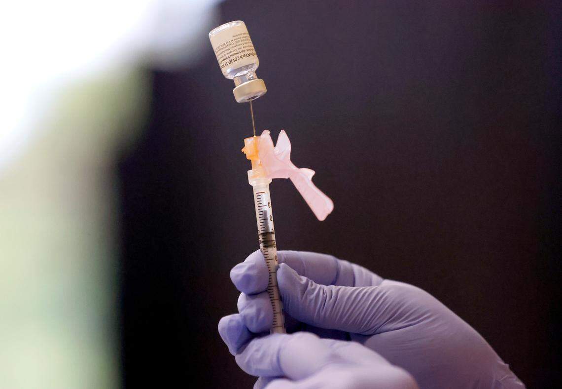 WakeMed pharmacist Michelle Cook prepares a Pfizer Covid-19 vaccine during the WakeMed Back-to-School Blitz vaccine clinic at the WakeMed Raleigh Campus in Raleigh, N.C., Sunday, August 1, 2021.