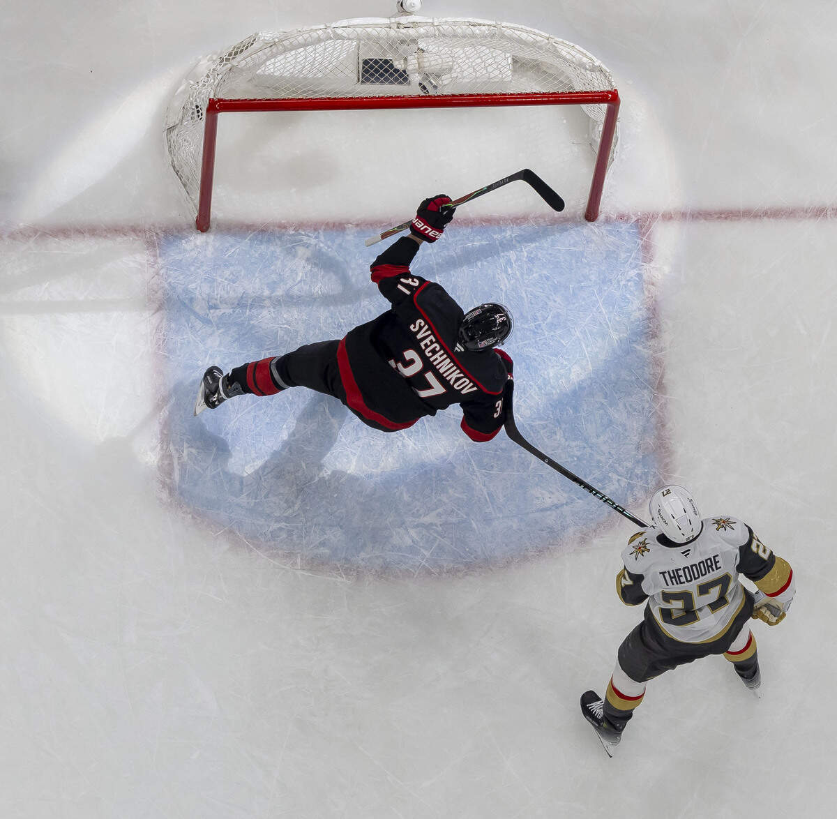 Carolina Hurricanes right wing Andrei Svechnikov (37) skates into the spotlight after Sebastian Aho scored in the second period to take 3-1 lead in Game 5 of the Stanley Cup Final against Vegas, on Thursday, June 11, 2026 at Lenovo Center in Raleigh, N.C.