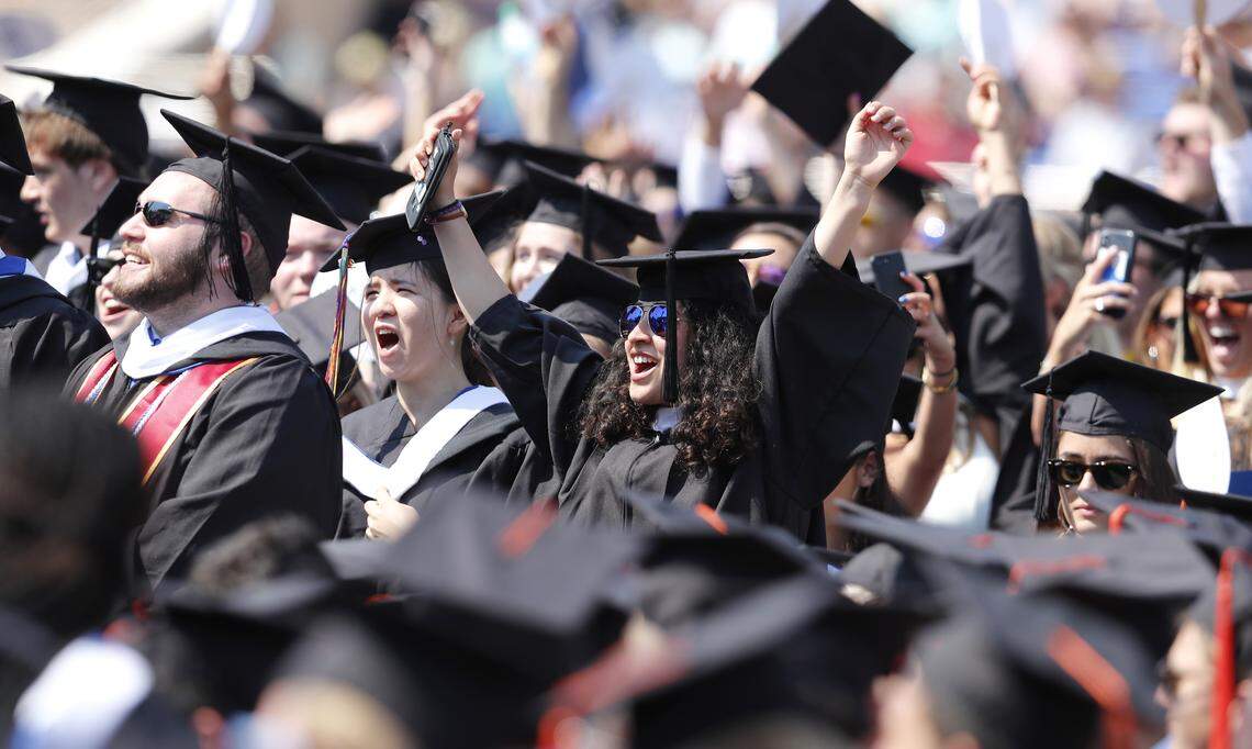 Graduates celebrate during Duke University’s commencement at Wallace Wade Stadium in Durham Sunday, May 13, 2018.
