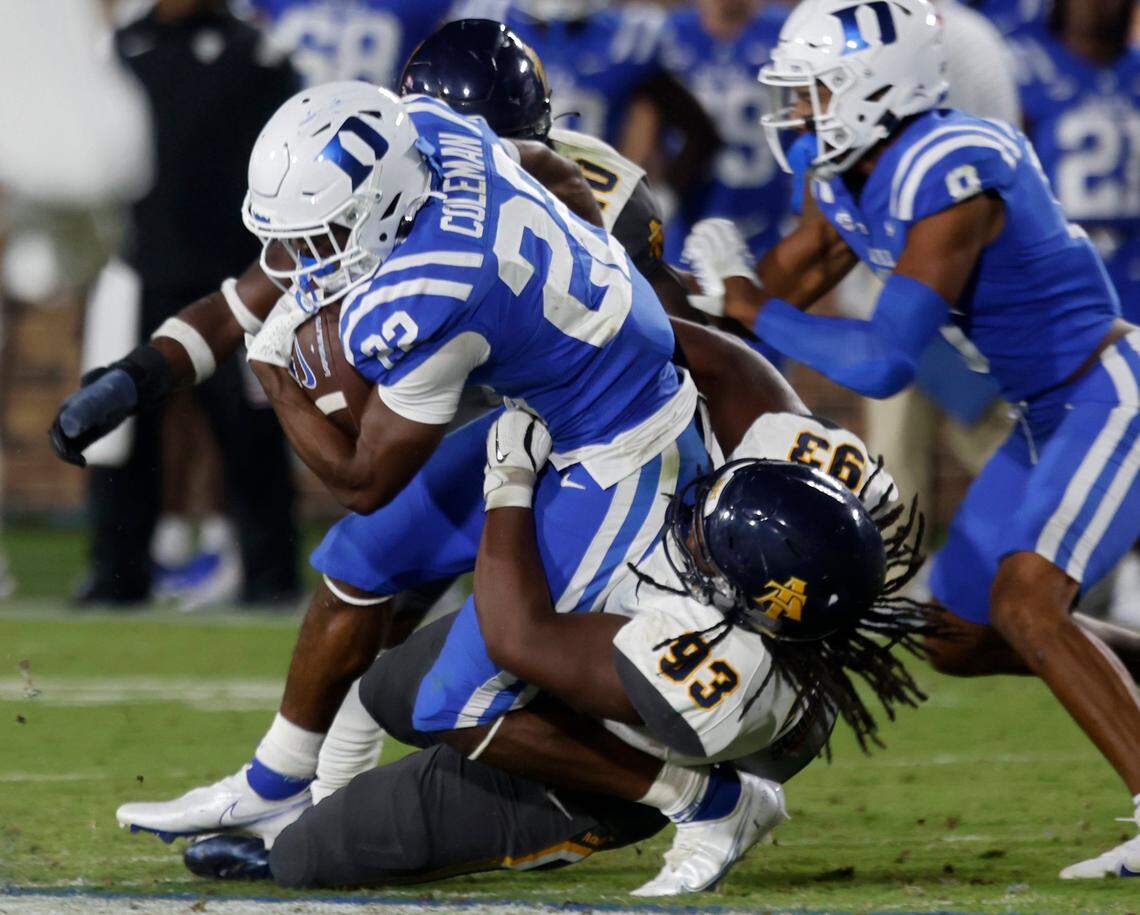 Duke Blue Devils running back Jaylen Coleman is tackled by North Carolina A&T Aggies defensive lineman Jhyheem Pittman during the second half of Dukes game against North Carolina A&T at Wallace Wade Stadium in Durham, N.C. on Saturday, Sept. 17, 2022.