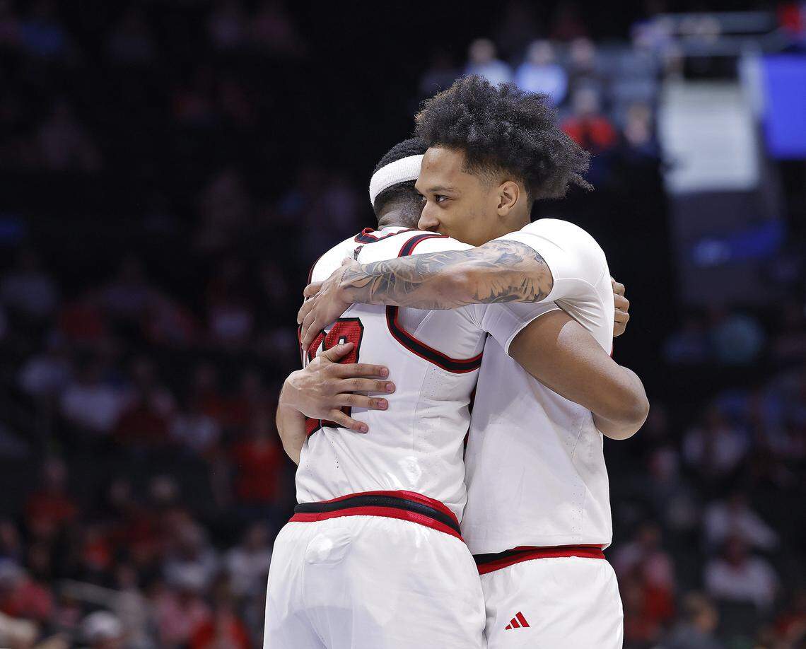 N.C. State's Ven-Allen Lubin and Darrion Williams embrace prior to the tip-off of the Wolfpack’s second-round ACC Tournament game against Pitt on Wednesday, March 11, 2026, at the Spectrum Center in Charlotte, N.C. 