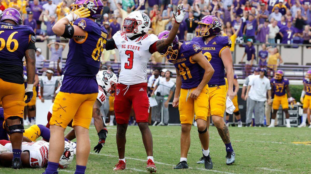 N.C. States Aydan White (3) celebrates after East Carolinas Owen Daffer (41) missed a potential game-winning field goal with five seconds left in the game during N.C. States 21-20 victory over ECU at Dowdy-Ficklen Stadium in Greenville, N.C., Saturday, Sept. 3, 2022.