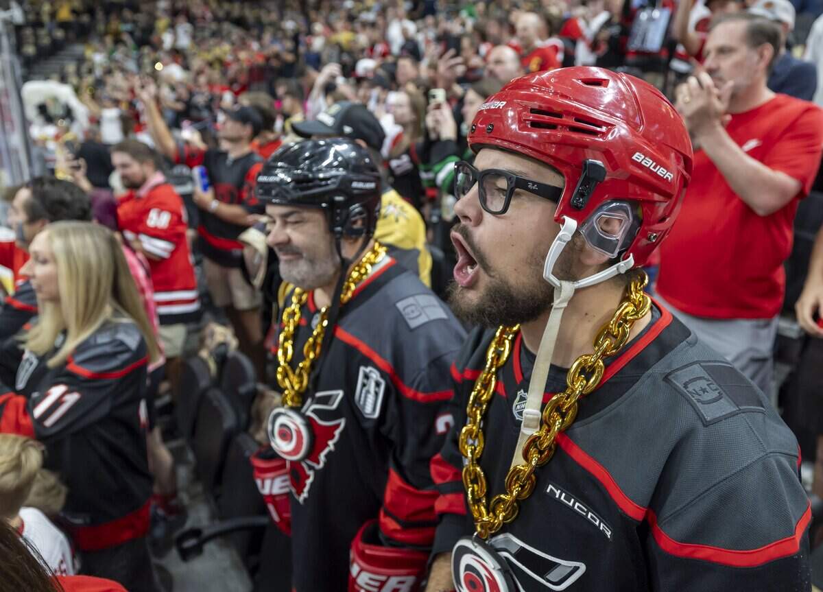 Nicholas Torri and his father Bill Torri of Clayton, N.C., watch the Carolina Hurricanes warm up for Game 6 of the Stanley Cup Final, on Sunday, June 14, 2026 at T-Mobile Arena in Las Vegas, NV.
