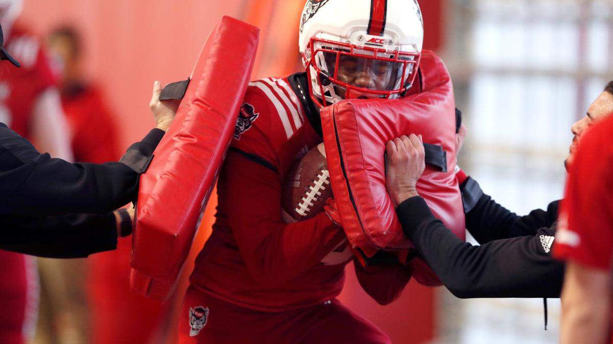 N.C. State’s Porter Rooks (14) runs drills during N.C. State’s football practice in Raleigh, N.C., Friday, March 6, 2020.