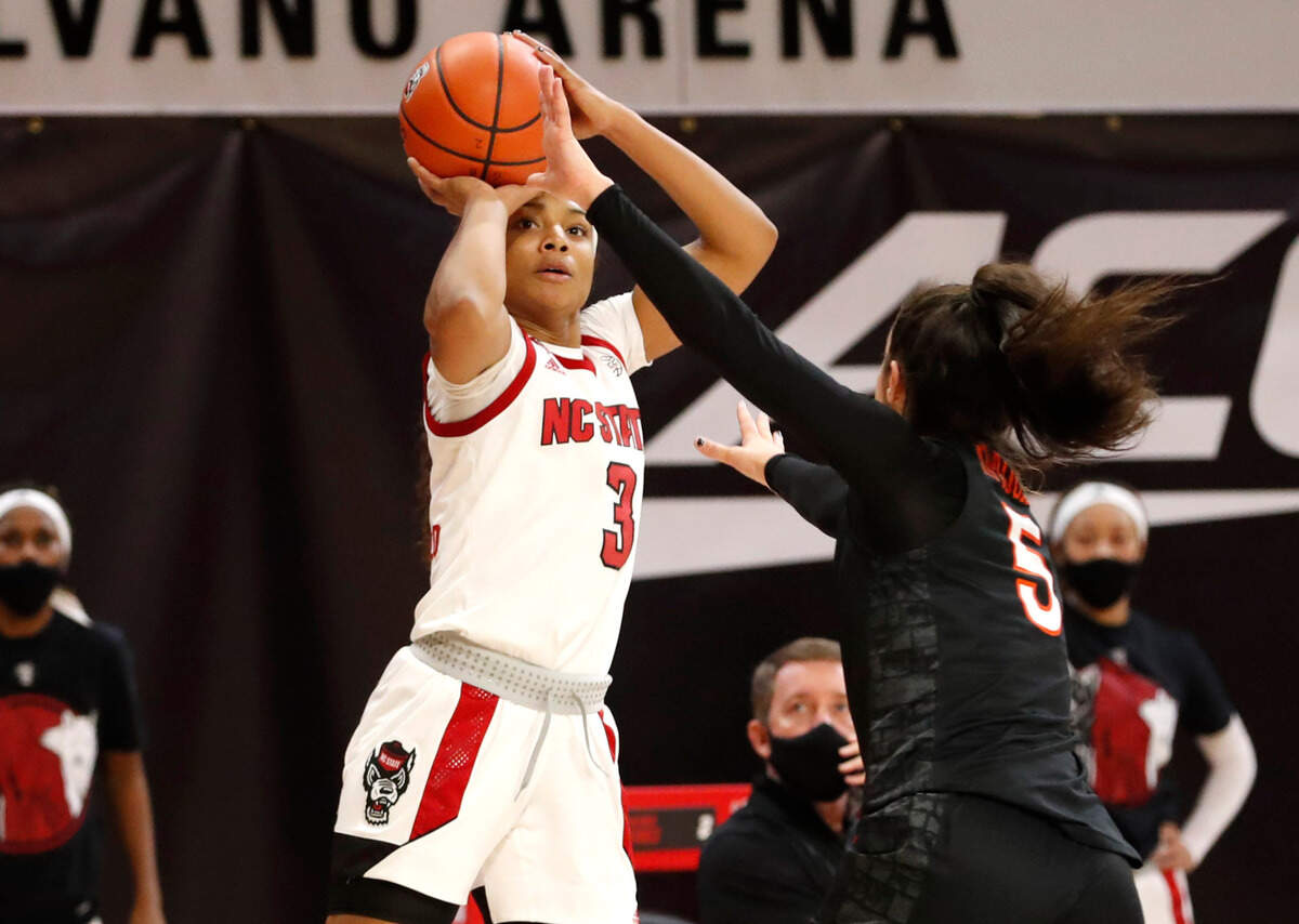 N.C. State’s Kai Crutchfield (3) shoots as Virginia Tech’s Georgia Amoore (5) defends during the second half of N.C. State’s 89-87 victory over Virginia Tech at Reynolds Coliseum in Raleigh, N.C., Sunday, January 24, 2021.