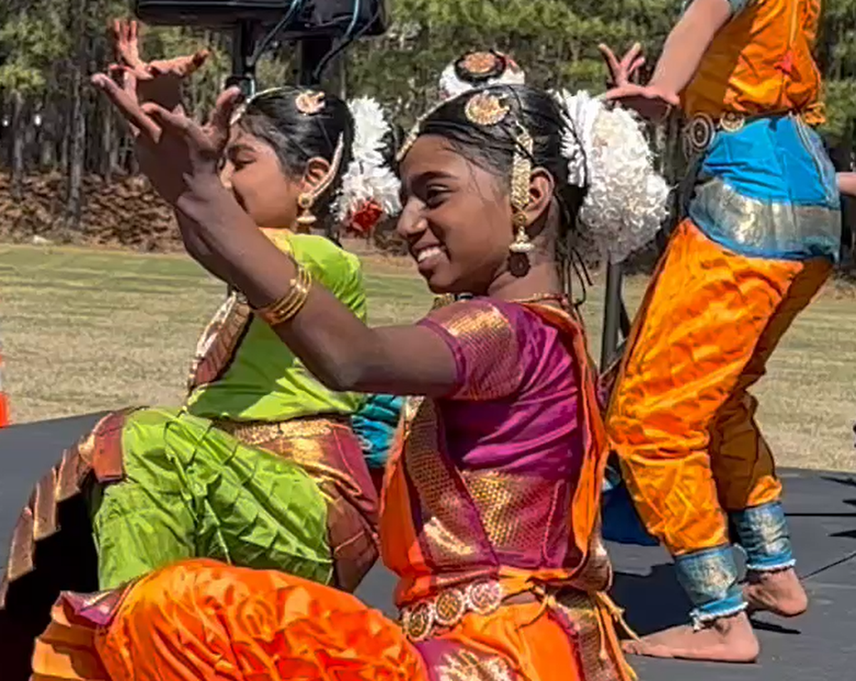 Aadya Balakrishnan of the Gurukrupa School of Indian Dance performed at Morrisville’s 4th annual Holi festival. During the routine her earring fell off, which she then stepped on, slicing her foot. But she didn’t let it affect her performance.