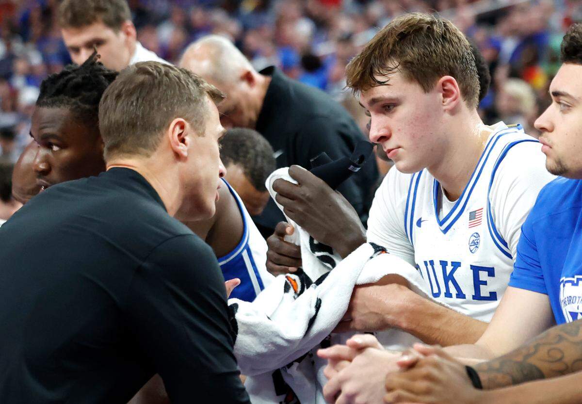 Duke head coach Jon Scheyer talks with Cooper Flagg (2) during the second half of Kansas’ 75-72 victory over Duke in the Vegas Showdown at T-Mobile Arena in Las Vegas, Nev., Tuesday, Nov. 26, 2024.
