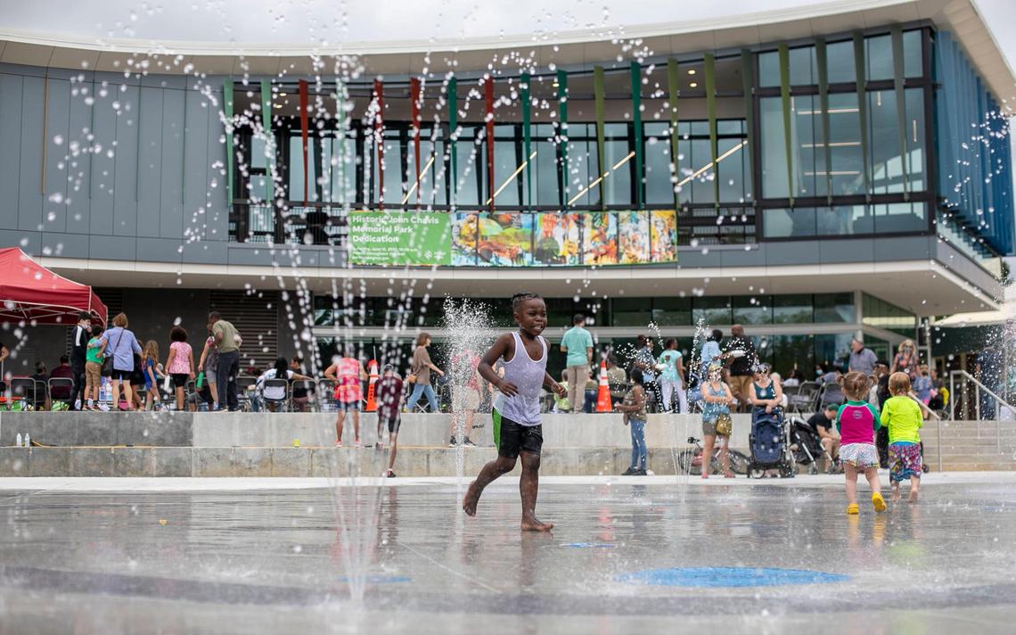 Children play in the interactive splash fountain at the newly renovated Chavis Park following the ribbon cutting and grand re-opening on Saturday, June 12, 2021 in Raleigh, N.C.