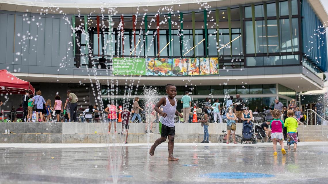 Children play in the interactive splash fountain at the newly renovated Chavis Park following the ribbon cutting and grand re-opening on Saturday, June 12, 2021, in Raleigh, N.C. Raleigh was recently named the third-happiest city to live in the United States.