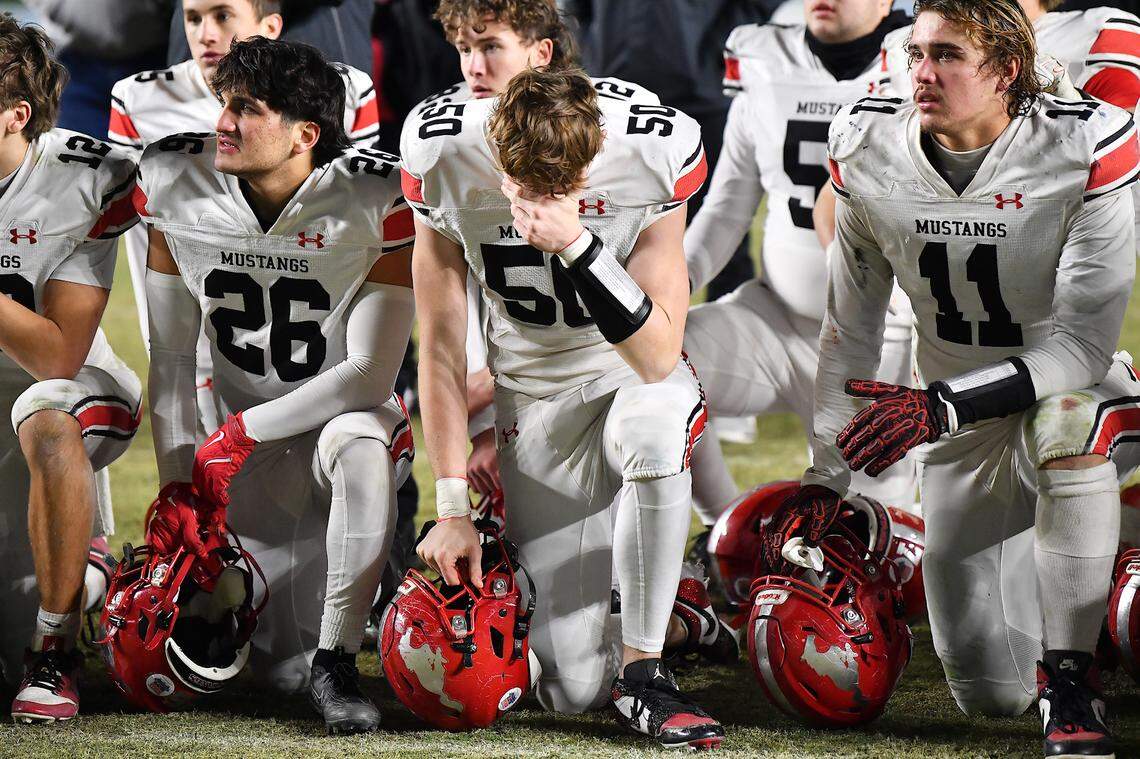 Middle Creek's Jackson Haider (50) reacts to their teams loss to Watauga in the NCHSAA 7A Football Championship game. The Middle Creek Mustangs and the Watauga Pioneers met in the NCHSAA 6A Football Championship game in Chapel Hill, N.C. on December 12, 2025. 