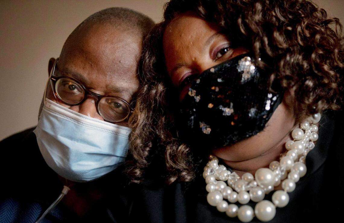 David McShaw, left, and Jacqueline McShaw sit for a portrait together shortly after co-pastoring a Sunday morning church service together over a Zoom video call in their home while they each continue to recover from a COVID-19 infection, for which David spent 49 days in the hospital, on Sunday, Nov. 22, 2020, in Oxford, N.C.