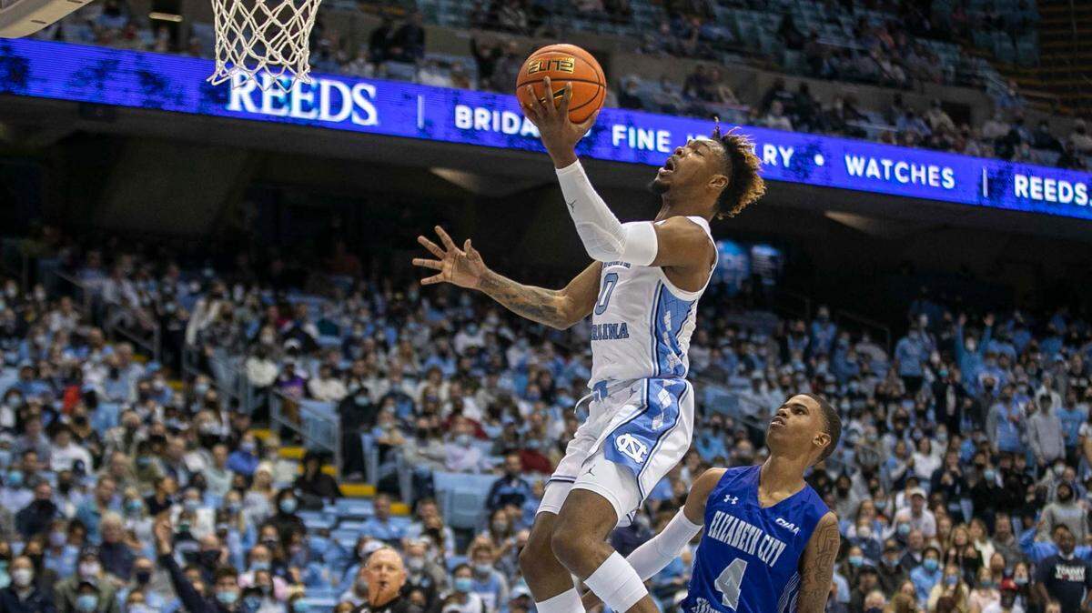 North Carolina’s Anthony Harris (0) breaks to the basket on a fast break ahead of Elizabeth City State’s Charles Page (4) during the second half on Friday, November 5, 2021 at the Smith Center in Chapel Hill, N.C.