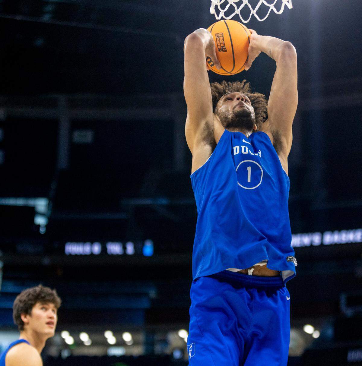 Duke’s Dereck Lively II (1) goes to the basket for a dunk during the Blue Devils’ practice on Wednesday, March 15, 2023 at the Amway Center in Orlando, Fla.